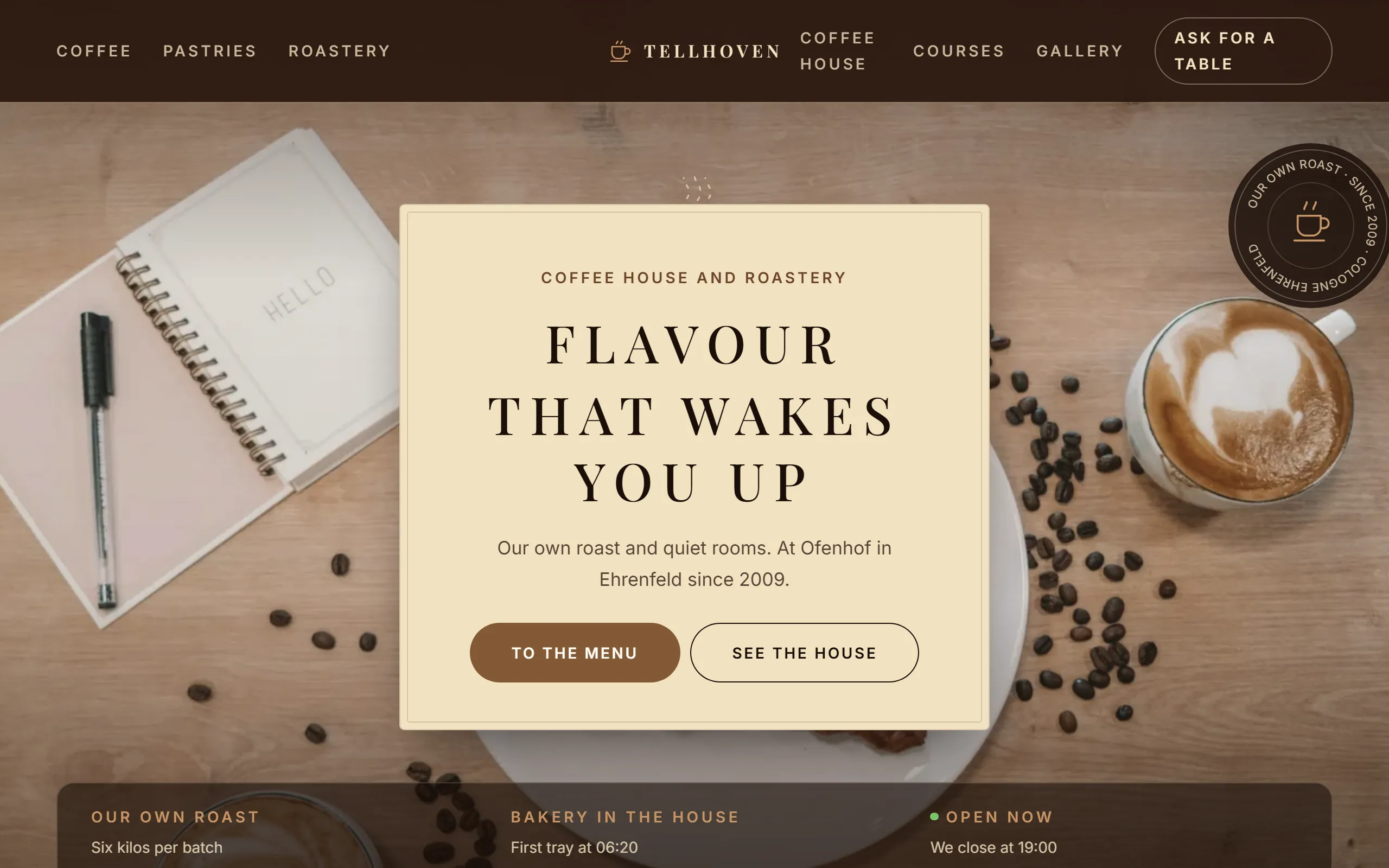 Home page of the Tellhoven template with a cream coloured panel on a dark, blurred café photograph and a capitals headline