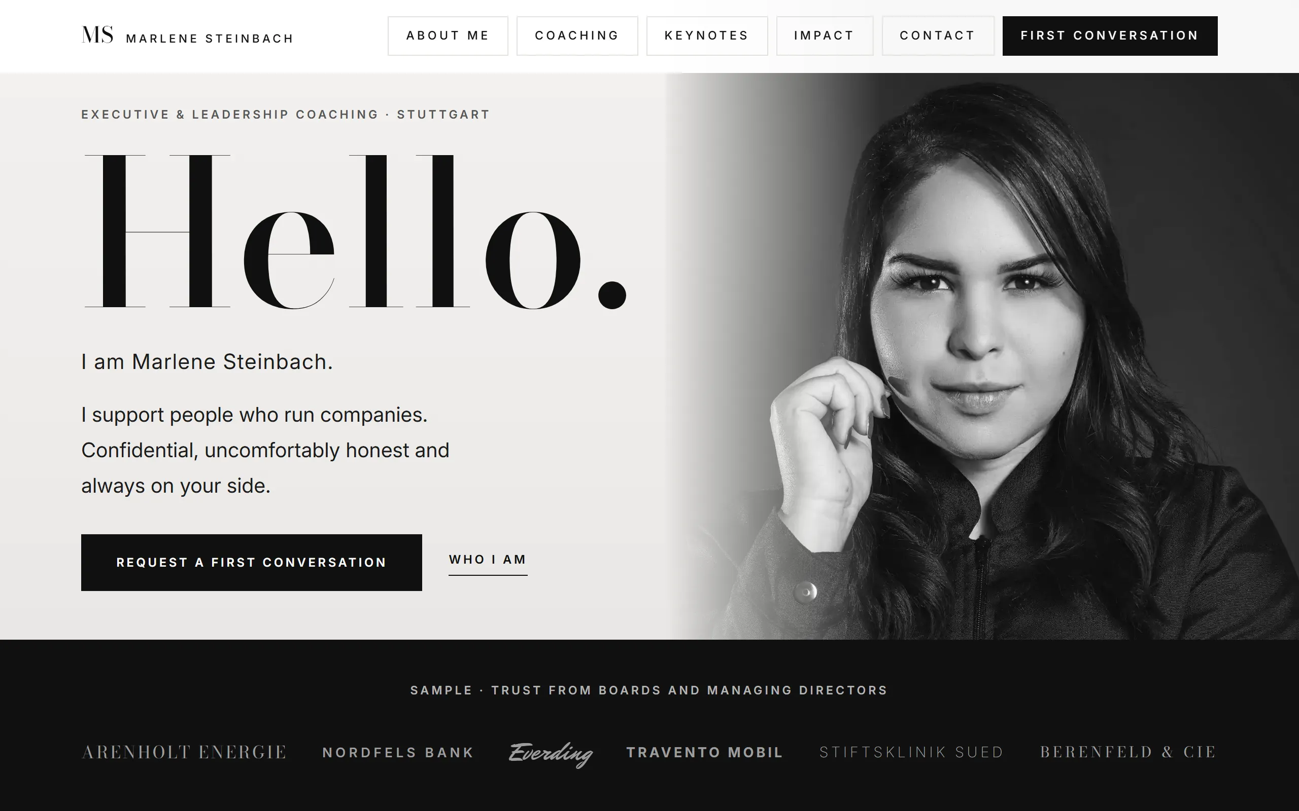 Home page of the Steinbach template, a huge serif greeting next to a black and white portrait behind a grey gradient