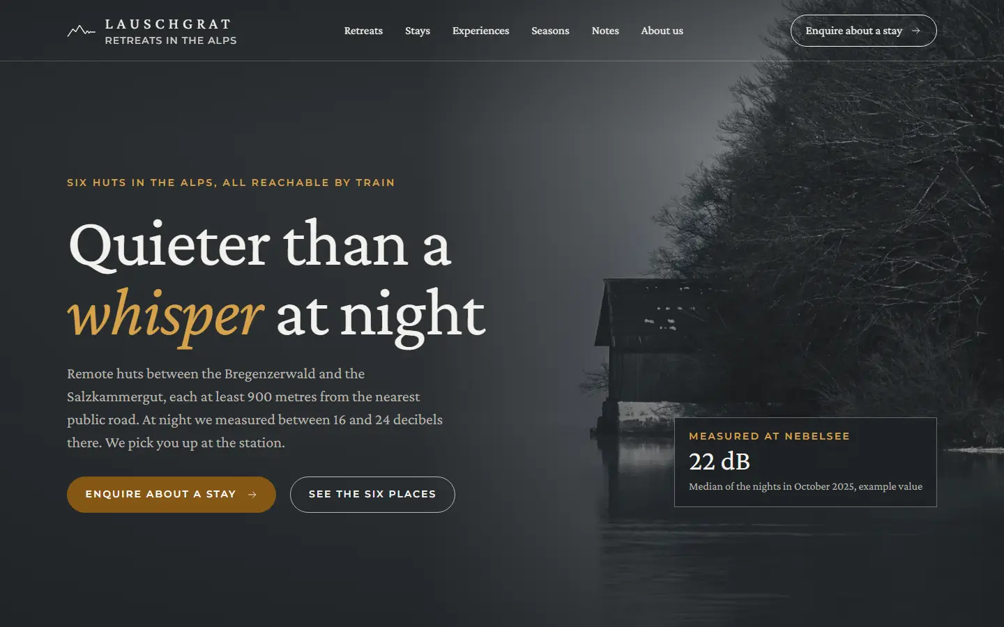 Home page of the cabin template with a dark boathouse on a lake disappearing into fog, the Lauschgrat wordmark in a transparent header, the headline about nights quieter than a whisper with one italic word in larch, two buttons and a small panel with 22 dB measured at the lake