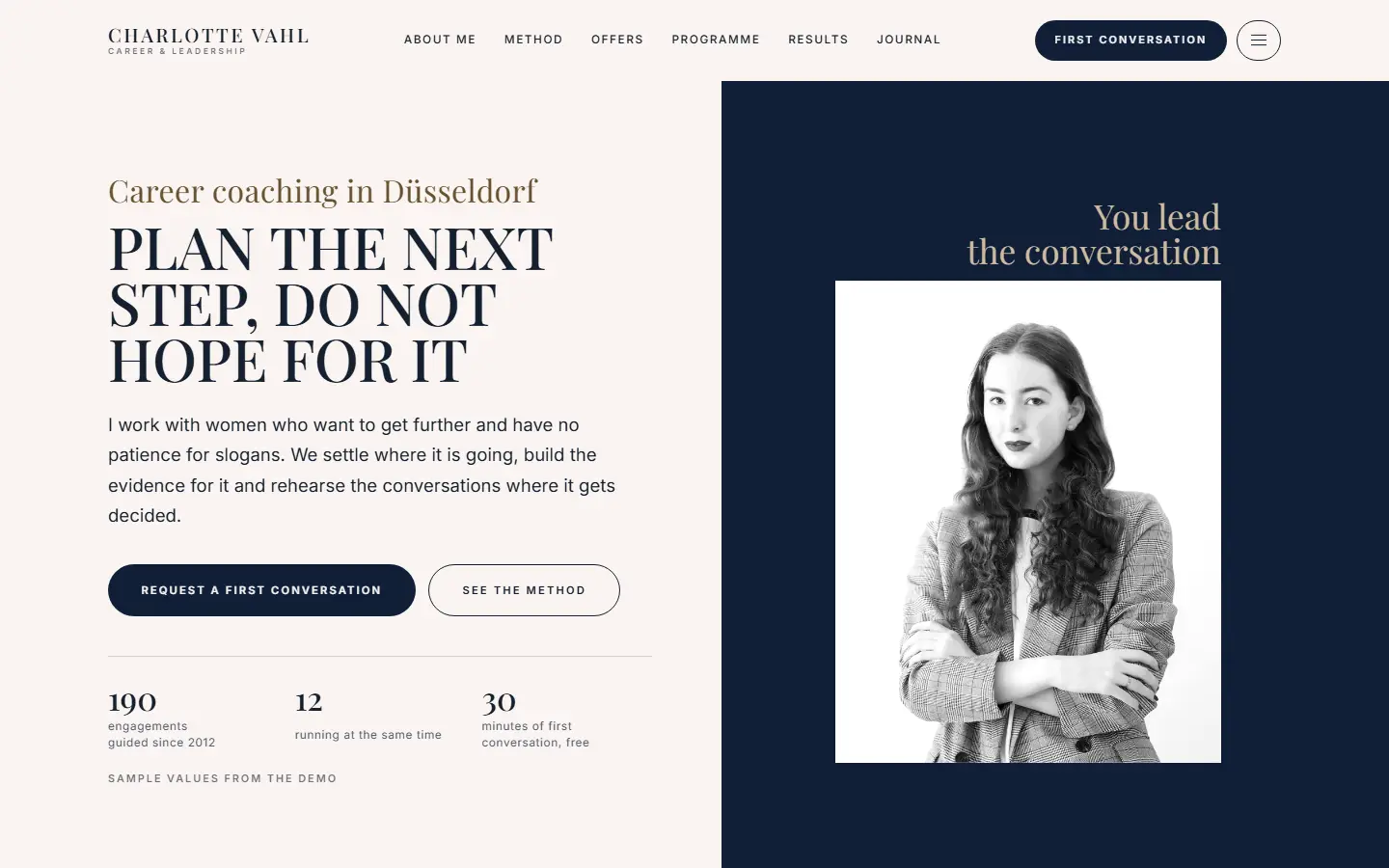 Home page of the Klarstand template, cream on the left with a headline in capitals, navy on the right with a black and white portrait, both halves edge to edge
