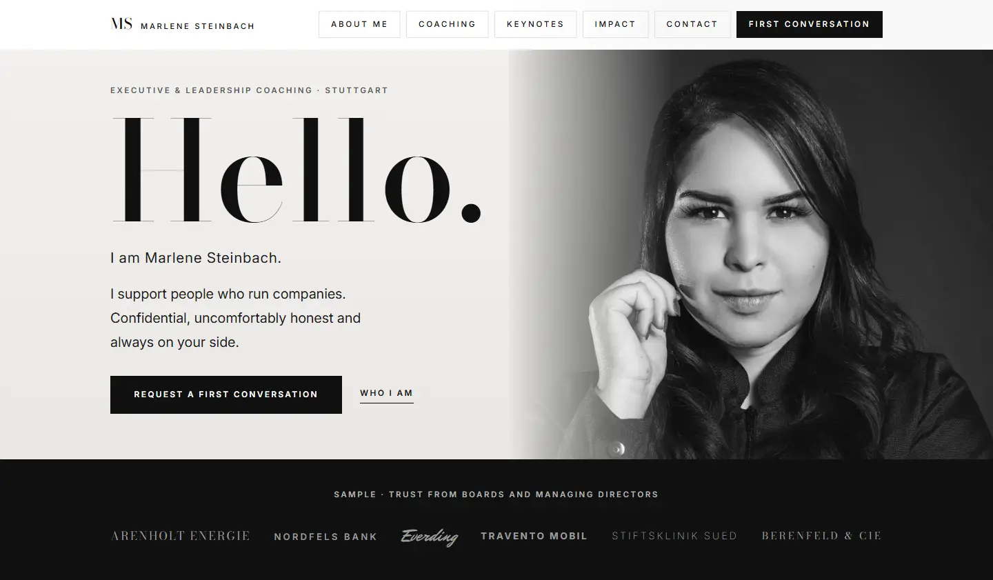 Home page of the Steinbach template, a huge serif greeting next to a black and white portrait behind a grey gradient